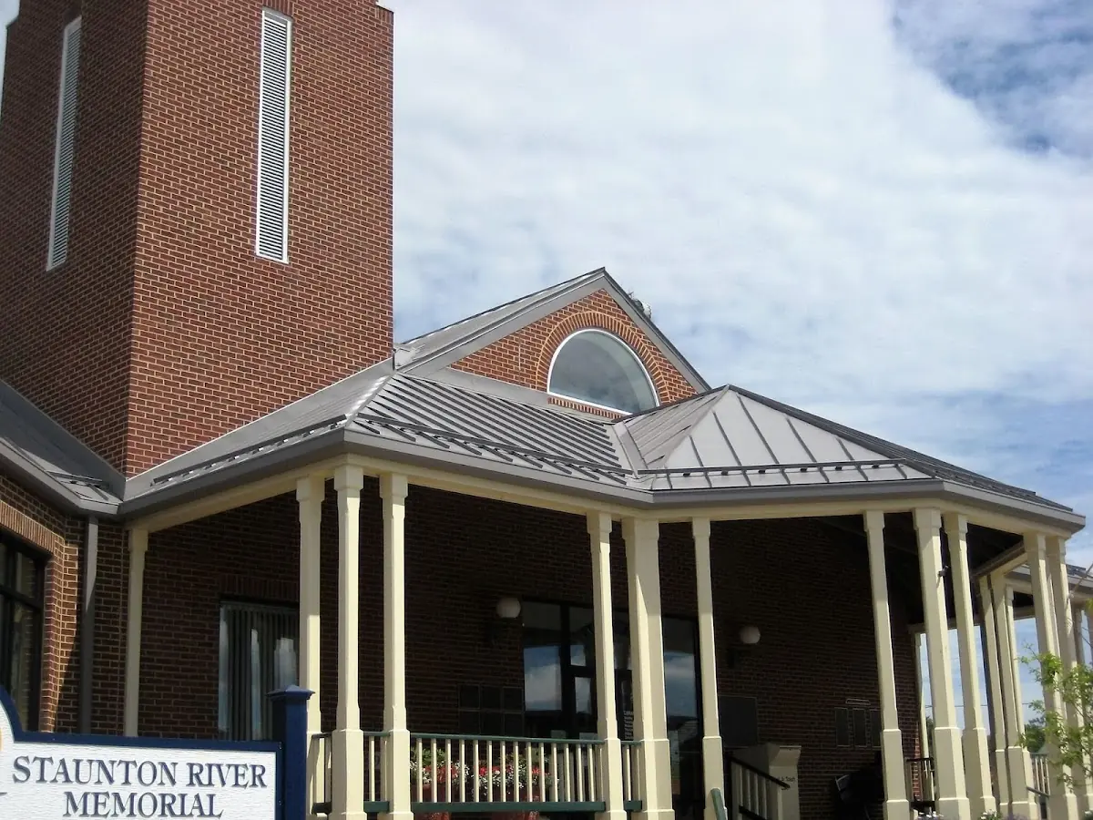 Skilled roofing craftsmen working on a residential roof in Sylvan-Highlands